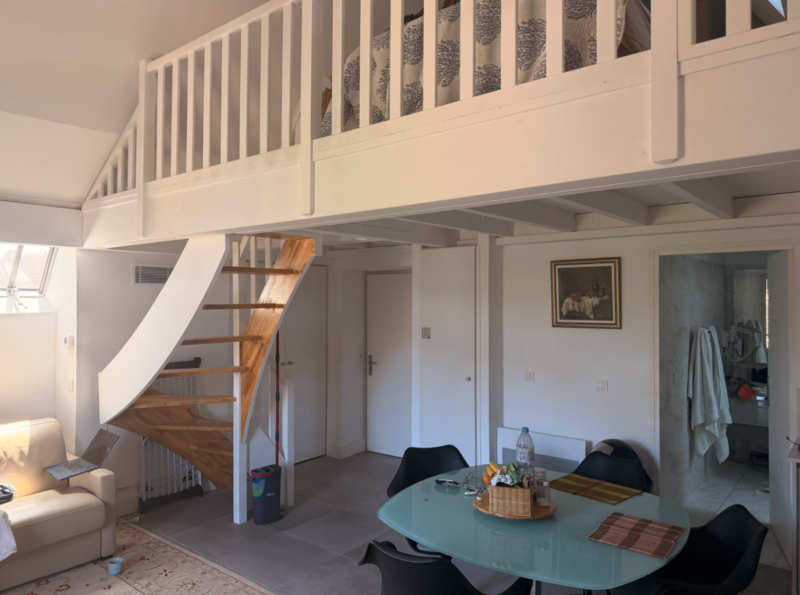 Loft bedroom above the living area with oak staircase