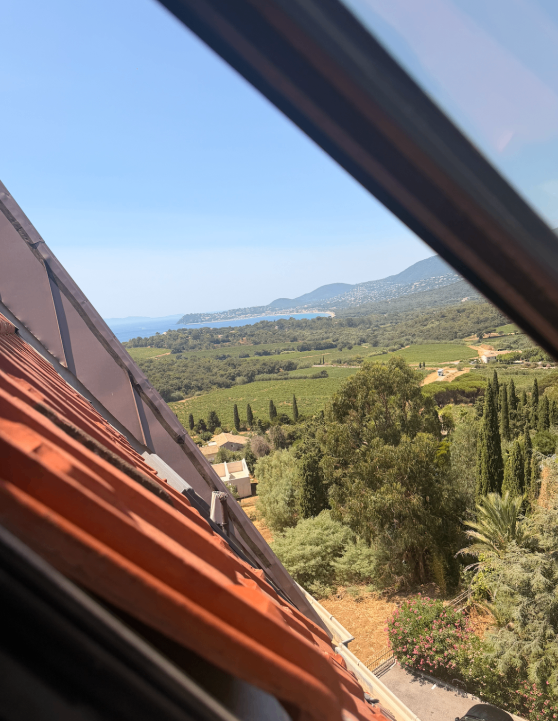 Terracotta roof tiles framing the coastal view