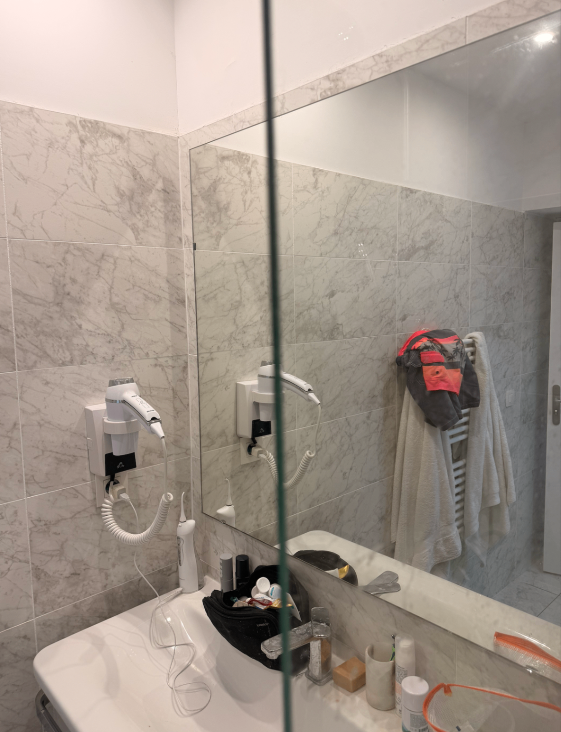 Marble bathroom detail with heated towel rail