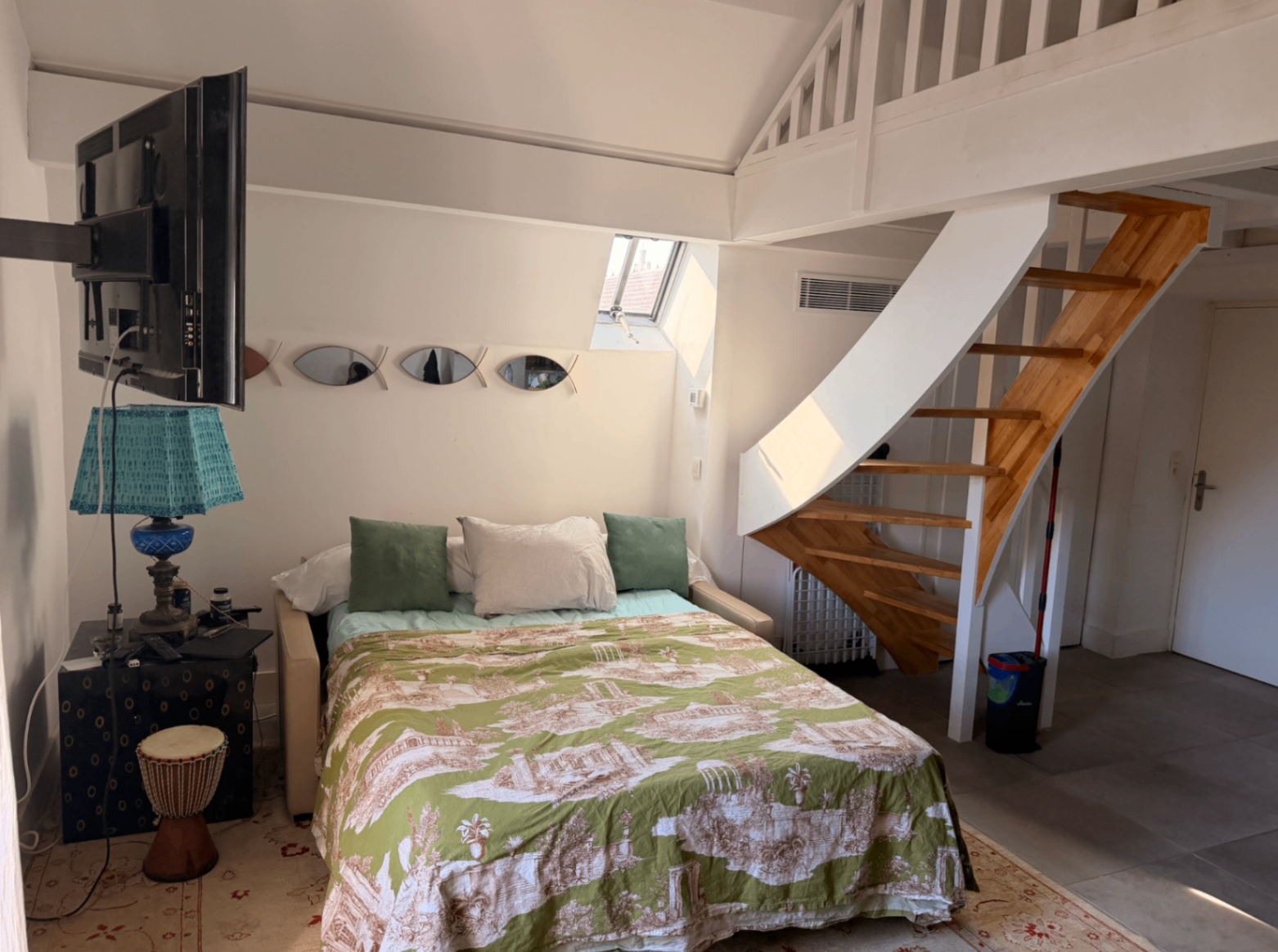 Convertible daybed arranged below the loft sleeping area